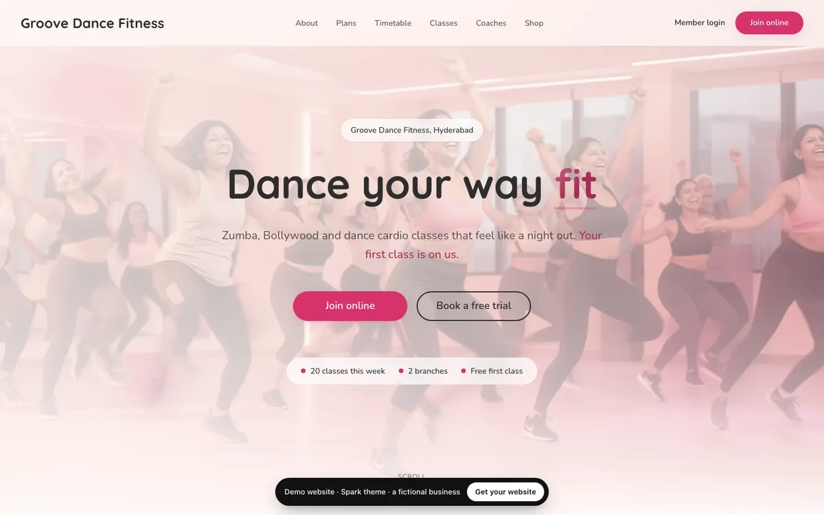 The Spark website design on a computer, shown with a fictional business